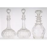 Pair of glass decanters and stoppers, with faceted slim neck over a fruiting vine etched border over