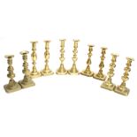 Five pairs of Victorian brass candlesticks, the tallest 9" high