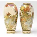Pair of Japanese Satsuma baluster vases, decorated with birds among branches and flowers, signed,