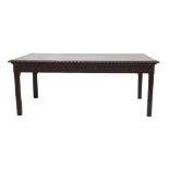 Large mahogany carved dining/library table, the rectangular top with carved moulded edge over a
