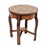 Decorative Moorish parquetry inlaid two tier circular occasional table, inset with exotic timbers