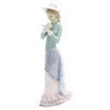 Lladro - figure of an elegant lady reading, factory stamp and impressed mark 'G-14 N' underside, 14"