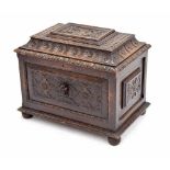 Victorian carved oak cellarette/wine cooler, the hinged cover with figural panel within multiple