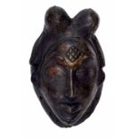 Early 20th century bronze Gabon tribal mask, modelled with lobed coiffure, typical geometric