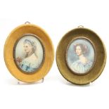 Two oval portrait miniatures of elegantly dressed ladies, initialled, 3.5" high, within baize