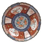 Good large Imari porcelain charger, decorated centrally with floral ring within panelled border