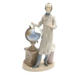 Lladro - large figural group of a scholar reading from his papers standing by a globe, further