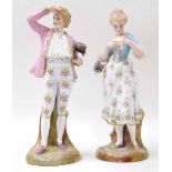 Pair of late 19th century German porcelain figures in the manner of Meissen, modelled as a gentleman