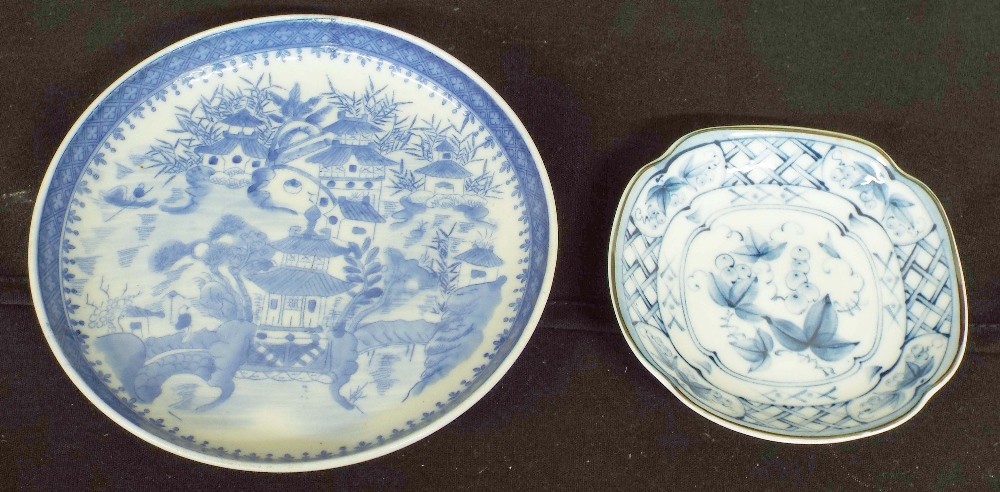 Chinese blue and white porcelain side plate, decorated with a pagoda scene within dense rim