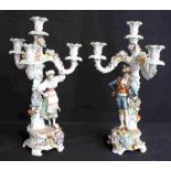 Pair of German figural and floral encrusted porcelain candelabra, late 19th century, featuring a