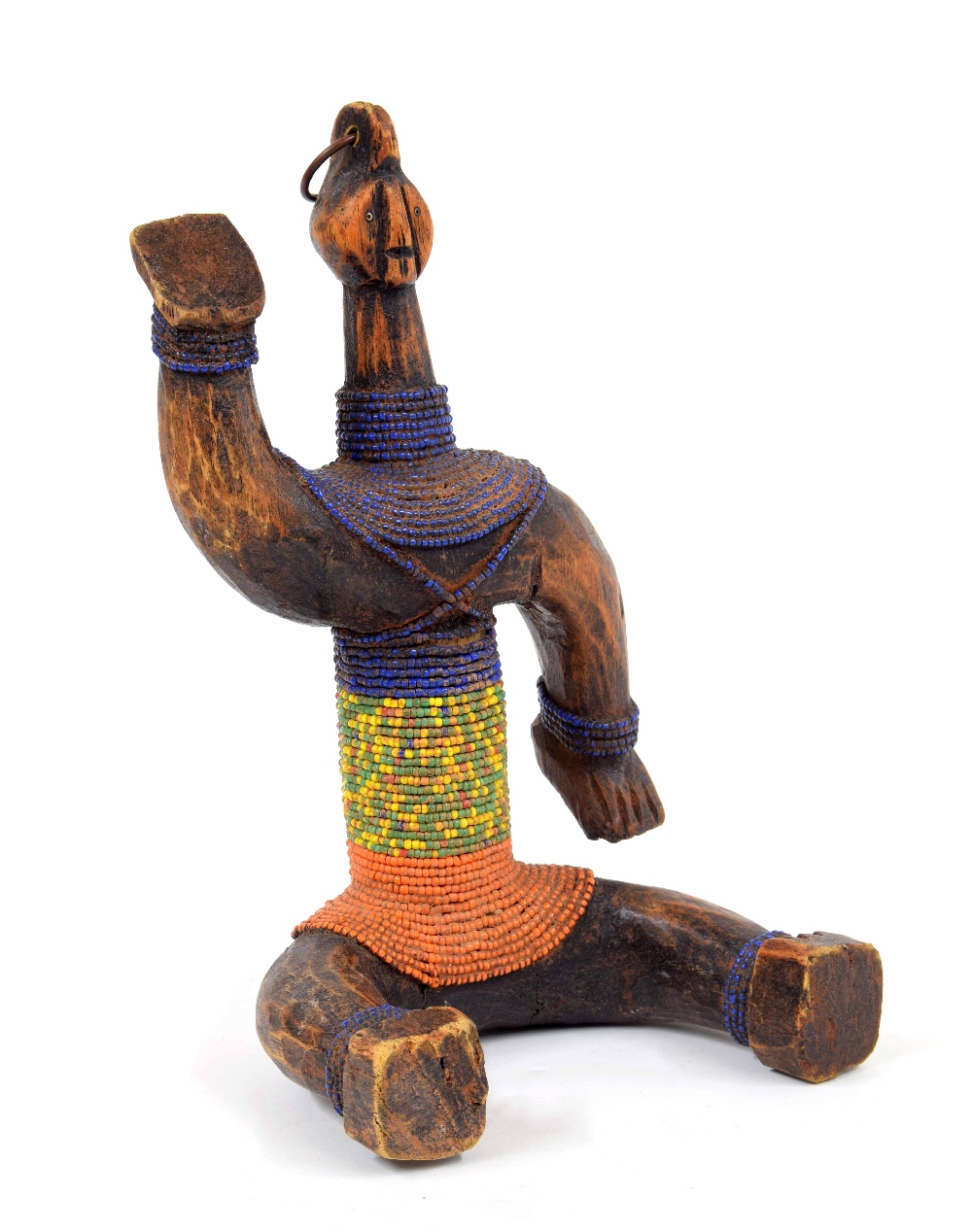 20th century carved Ethiopian Konso figure of a seated gentleman, wearing slim strings of coloured - Image 2 of 4