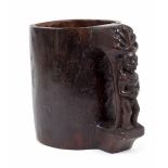 Indonesian (Nias Islands) carved wooden grain measure/cup, featuring ancestor figural handle of