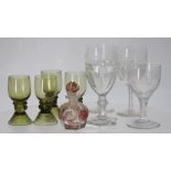 Pair of cut glass wine glasses, the bowl half cut under an etched fruiting vine border around an