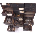 Thirty drawer wooden chest containing a quantity of various sized watch glasses to include high dome