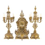 French ornate gilt metal two train mantel clock garniture, the movement striking on a bell, the 4"