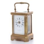 Miniature carriage clock timepiece bearing the retailer's name J. Edmond, 67 Baker Street, London on