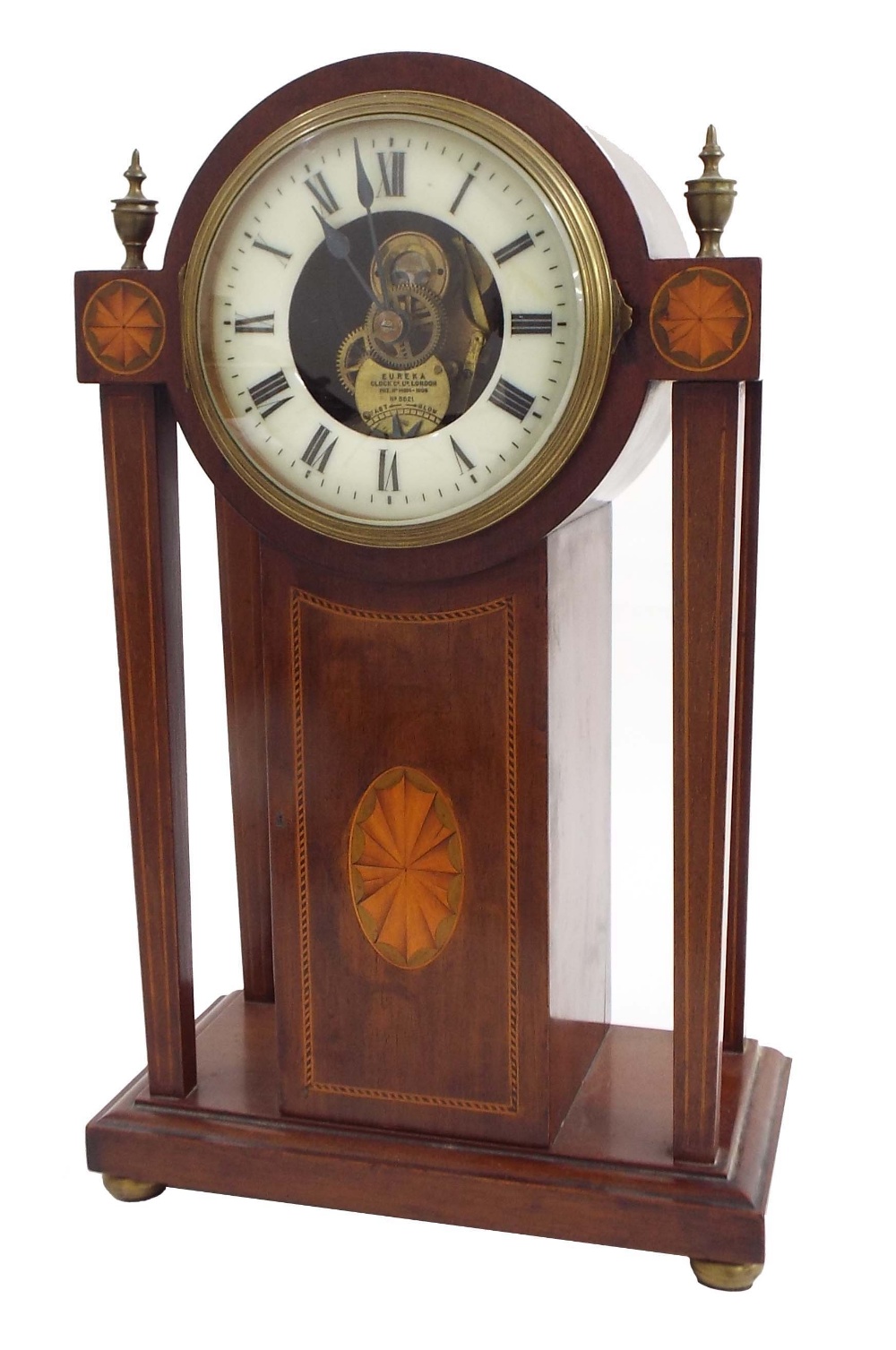 Eureka electric mantel clock, the 4.25" cream chapter ring enclosing a skeletonised centre inscribed