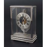 Jaeger LeCoultre small mystery desk clock timepiece, the 1.75" silvered chapter ring enclosing a