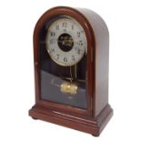 Bulle mahogany electric mantel clock, the 4.5" silvered dial with skeletonised centre, within a