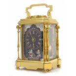 Good French gilded brass repeating carriage clock striking on a gong, the black painted porcelain