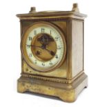 French brass two train mantel clock striking on a gong, the 3.75" cream chapter ring enclosing a