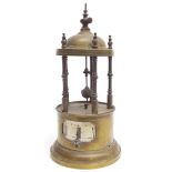 Novelty brass pagoda housed ticket clock, the hours indicated by a pointer fitted by an aperture