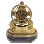 Unusual small brass skeleton clock timepiece, the 3.75" chapter ring pierced with Arabic numerals