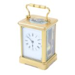 Small French carriage clock striking on a gong, within a corniche brass case, 5.5" high (key & box)