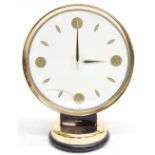 Smiths/Jaeger contemporary mystery electric clock, the 7" Perspex dial within a gilt bezel and