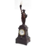 American spelter 'Statue of Liberty' novelty clock timepiece, the 2" dial inset into a stepped