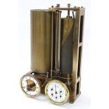 Vintage brass water meter clock, with two dials situated beneath two brass revolving cylinders one