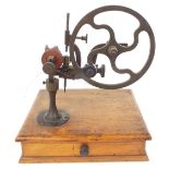 Small antique wheel cutting tool, upon a square base fitted with a single drawer containing