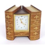 Jaeger electronic novelty desk clock timepiece, contained within two hinged tooled gilt leather