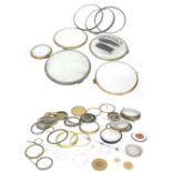 Large quantity of various clock bezels, dials and chapter rings