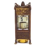 Junghans gilt metal cased ticket clock, with bevelled glazed sides and surmounted by an acorn