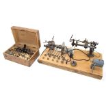 Good Lorch 10mm electric lathe with collets etc, mounted upon a wooden board, 25" x 14"; also a