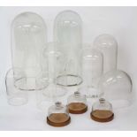 Eleven various glass clock domes, tallest 16.25" high