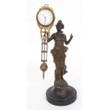 Bronzed mystery clock, modelled as a young lady standing in a flowing dress holding aloft the