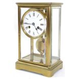 Small French brass four glass two train mantel clock striking on a bell, the 3.25" white dial