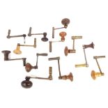 Twelve brass and steel clock winding keys with turned wooden handles (12)