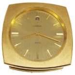 Omega eight day desk clock timepiece with calendar aperture, within a brushed brass angled case, 3.