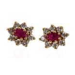 Pair of 18ct ruby and diamond cluster earrings, the rubies each 0.25ct approx, 1.6gm, 10mm x 8.5mm