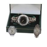 White metal lady's bangle watch, black enamel dial with Arabic numerals, minute track and five