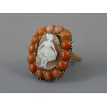 Georgian oval carved cameo ring, the central panel depicting a young dancing lady, surrounded by