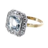 18ct aquamarine and diamond cluster ring, the aquamarine 2.30ct, in a surround of round brilliant-