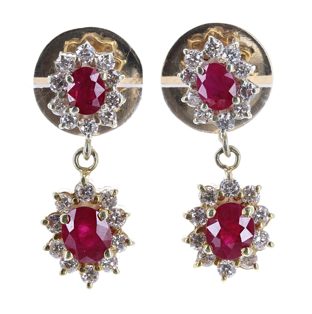 Fine pair of 18ct ruby and diamond drop earrings, each with two graduated oval clusters with a