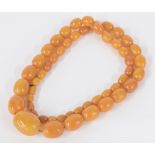 Graduated butterscotch amber bead necklace, consisting of 51 beads, 99.3gm, 10mm- 33mm, 30" long
