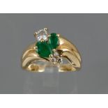 Modern 14ct emerald and diamond ring, the two central pear-shaped emeralds, 0.50ct approx, with a