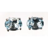 Pair of modern blue topaz silver set oval ear studs, 8mm x 6mm; with box