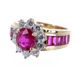 Good quality 18ct ruby and diamond dress ring, central oval ruby of good colour, 1.24ct approx,